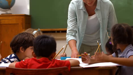 Cute-pupils-in-classroom-at-school