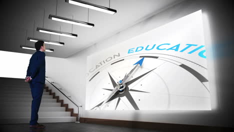 Businessman-viewing-education-compass-clip