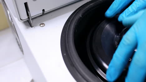 Chemist-using-centrifuge-in-the-lab