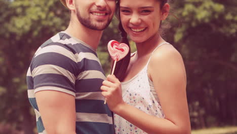 In-slow-motion-cute-couple-sharing-a-lollipop