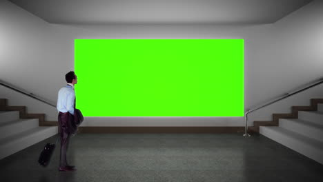 Businessman-looking-at-green-screen