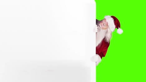 Santa-peeking-around-gift-card-on-green-screen-background