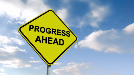 Progress-ahead-sign-against-blue-sky-