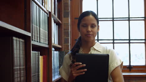 Student-picking-a-book-from-shelf-in-library