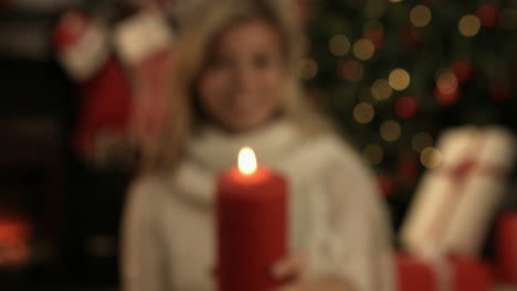 Pretty-blonde-showing-a-candle