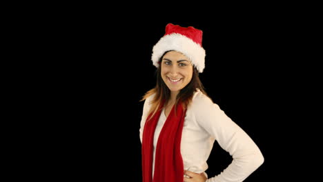 Woman-in-santa-hat-and-warm-clothing-blowing-over-hands-