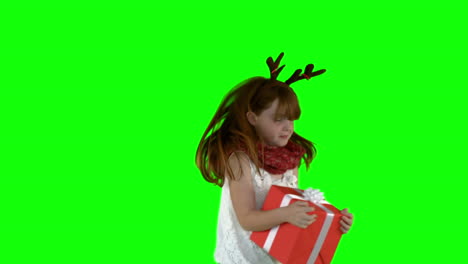 Little-girl-spinning-with-gift-in-slow-motion