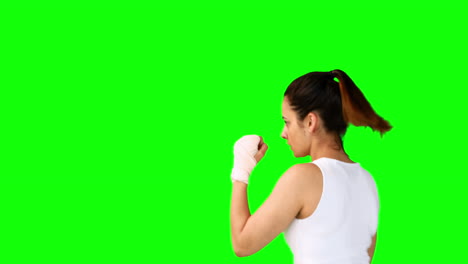 Fit-brunette-punching-with-bandaged-fists