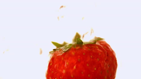 Water-falling-on-a-strawberry