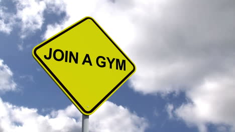 Join-a-gym-sign-against-blue-sky-