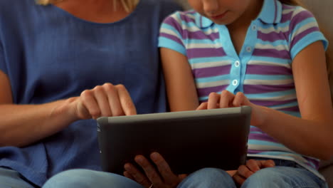 Mother-and-daughter-using-tablet-pc