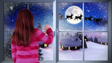 Little-girl-waving-to-santa-flying-over-village