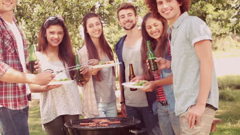 In-slow-motion-happy-friends-in-the-park-having-barbecue-
