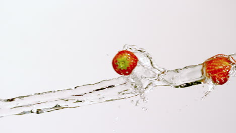 Strawberries-moving-through-stream-of-water
