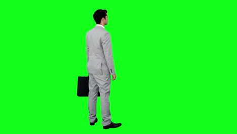 Businessman-standing-holding-his-briefcase