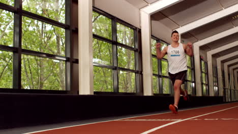 Fit-man-running-on-the-indoor-track
