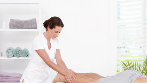 Physiotherapist-giving-sports-massage-to-patient
