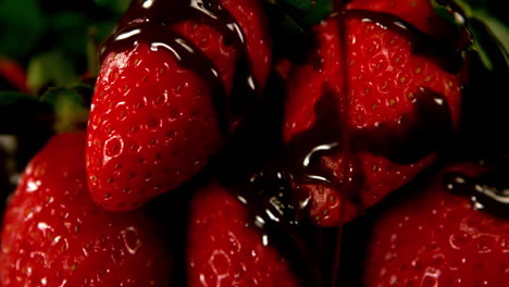 Melted-chocolate-pouring-over-strawberries