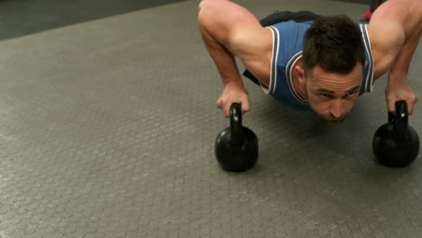 Fit-man-exercising-with-kettlebell