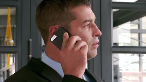 Elegant-businessman-on-phone-