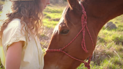 Pretty-woman-feeding-a-horse