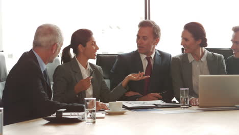 Smiling-business-people-having-a-meeting-