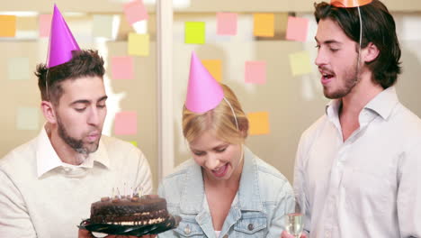 Smiling-casual-business-team-celebrating-birthday
