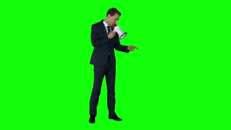 Businessman-speaking-in-megaphone-on-green-screen-