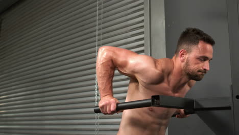 Fit-man-doing-pull-up-exercise-