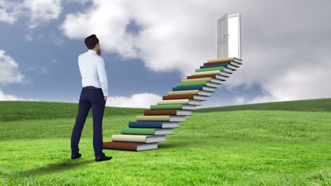 Businessman-looking-at-stair-made-of-books-on-a-green-field-
