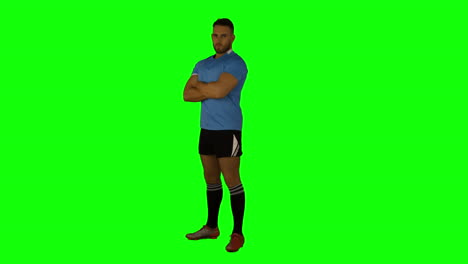 Serious-rugby-player-with-arms-crossed