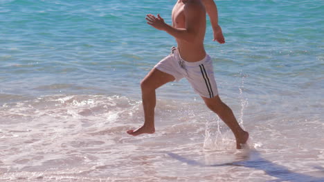 Man-running-at-the-beach