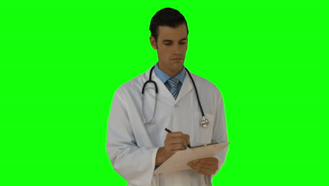 Young-doctor-writing-on-clipboard