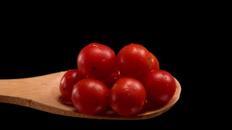 Wooden-spoon-spilling-cherry-tomatoes