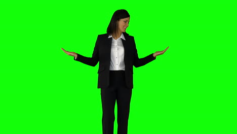 Businesswoman-wearing-something-with-her-hands-on-green-screen-