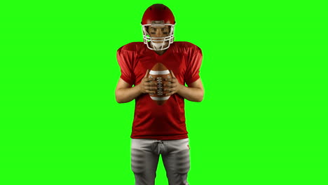 American-football-player-holds-a-ball