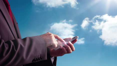 Businessman-using-smartphone-on-blue-sky-background