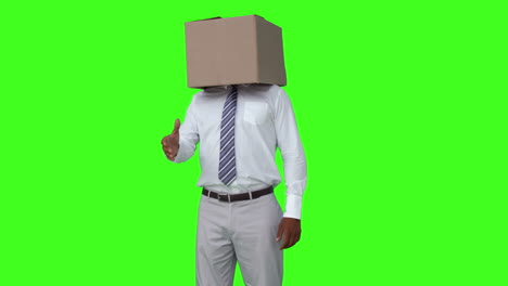 Businessman-with-box-over-head-shaking-hand