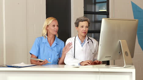 Female-doctors-using-tablet-and-computer