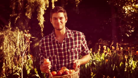 Handsome-man-holding-basket-and-eating-apple