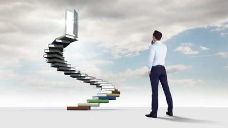 Businessman-looking-at-steps-made-of-books