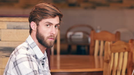 Handsome-man-using-his-laptop-computer-