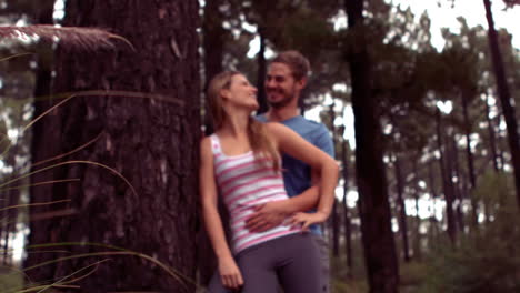 Couple-hiking-through-a-forest
