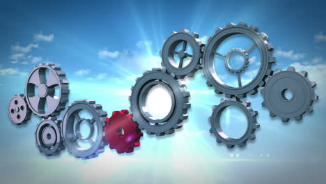 Cogs-and-wheels-turning-against-blue-sky