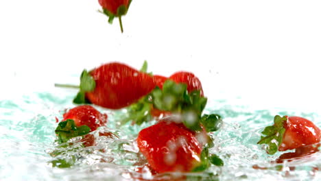 Strawberries-falling-on-water