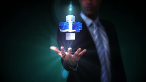 Businessman-presenting-holographic-cubes