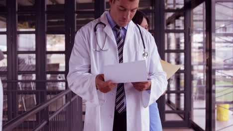 Doctor-and-nurse-reading-documents