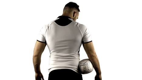 Un-Jugador-De-Rugby-Serio-Sostiene-Una-Pelota-De-Rugby.