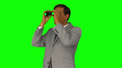 Businessman-looking-through-binoculars