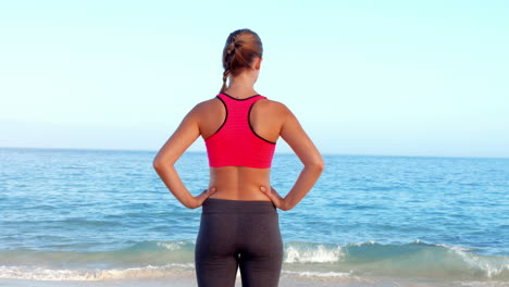 Fit-woman-standing-on-the-beach